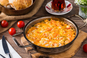 Traditional turkish breakfast food menemen made by eggs and tomatoes.