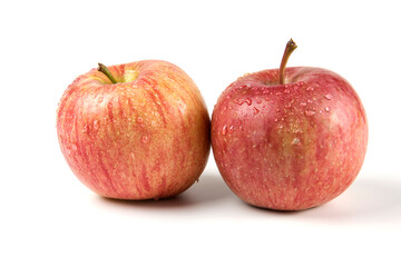Fototapeta na wymiar Two single whole red apple on white