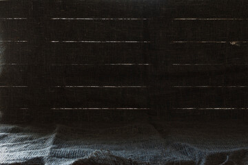Background image of boards with slits and burlap