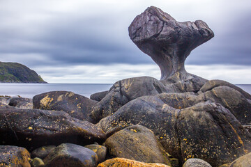 rainy clouds over the Kannesteinen rock on the coast of Norway