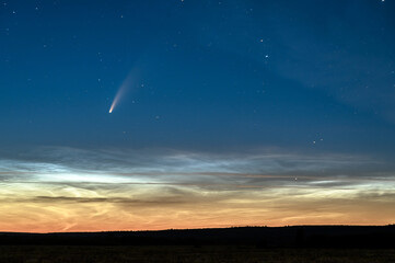 Fototapeta na wymiar Noctilucent Clouds and Comet C/2020 F3 Neowise in the night sky.