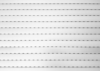 CLOSED WHITE ROLLER BLIND BACKGROUND. Patterns and texture. Abstract. Background of white grunge metallic roller shutter surface