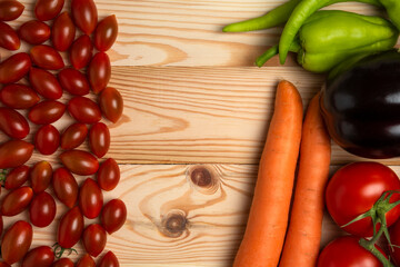 Berries with vegetable mix in the wooden table