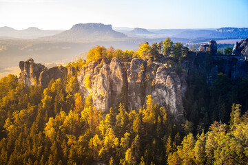 Colorful and lightful sunrise at the Bastei bridge above the Elbe River in the Elbe Sandstone...