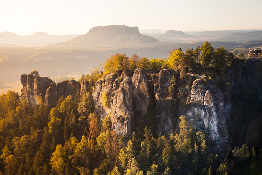 Colorful and lightful sunrise at the Bastei bridge above the Elbe River in the Elbe Sandstone Mountains of Germany. 