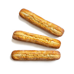Three crisp, fresh baguettes on a white background