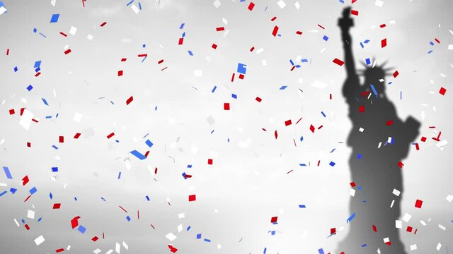 Colorful confetti against silhouette of statue of Liberty