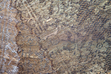 Beautiful textured surface of hand-woven retro lace for garment decoration. The beginning of the 20th century