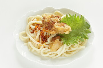Japanese food, deep fried chicken on chili pepper oil Udon for summer cold noodles