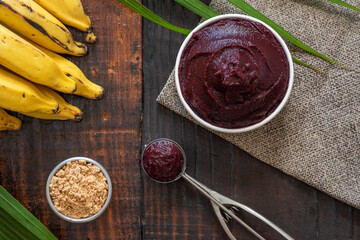 Acai bowl with fruit on table wooden