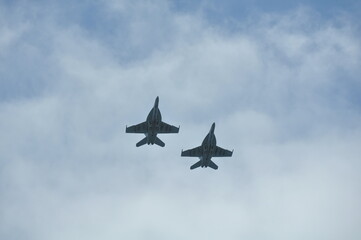 Fighter jets under cloudy sky