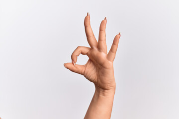 Naklejka premium Hand of caucasian young woman gesturing approval expression doing okay symbol with fingers