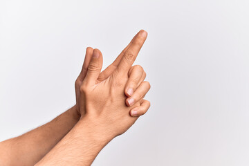Hand of caucasian young man showing fingers over isolated white background gesturing fire gun weapon with fingers together, aiming shoot symbol