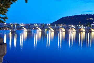 Charles Bridge over Vltava River in Prague at night
