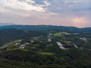 Fototapeta na wymiar Beautiful view of forested hills and sunset in rural Japan