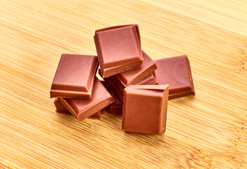 Chocolate on wooden table and white background