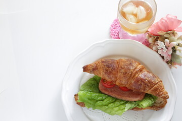 Homemade croissant and luncheon meat sandwich for breakfast