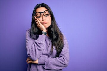 Young brunette woman wearing glasses over purple isolated background thinking looking tired and bored with depression problems with crossed arms.