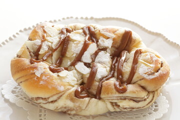 Homemade caramel and chocolate bun with copy space