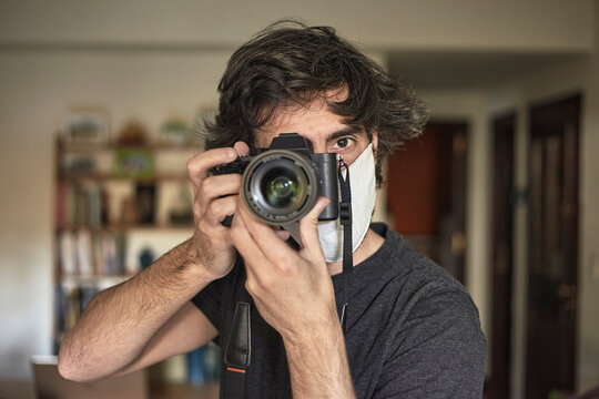 Portrait Of Photographer With Protective Mask Against Covid 19 In Photo Shoot