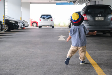 Little boy walking in car parking wear summer vacation cloth