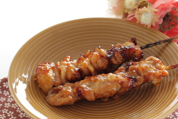 Japanese food, grilled chicken with bamboo skewer on white background