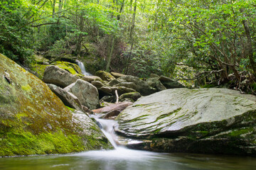 Naklejka na ściany i meble Waterfall on creek near mossy rocks, North Carolina, Appalachia, long exposure