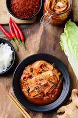 Kimchi cabbage with ingredients on wooden table, Korean food