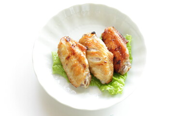 Homemade barbecue grilled chicken wing on lettuce with copy space