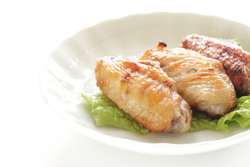 Homemade barbecue grilled chicken wing on lettuce with copy space