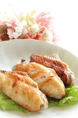 Homemade barbecue grilled chicken wing on lettuce with copy space