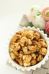 nut and caramel popcorn in bowl for snack food