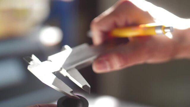 working with vernier caliper stainless steel measuring slow motion