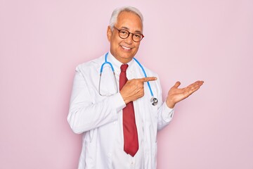 Middle age senior grey-haired doctor man wearing stethoscope and professional medical coat amazed...