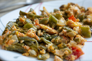 A closeup view of a plate of nopales and huevos.