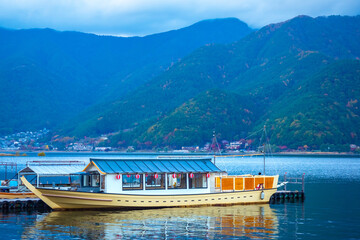 Japan. Pleasure boat at the dock in Kawaguchiko. Boat trips on the lake Kawaguchiko. Five lakes of...