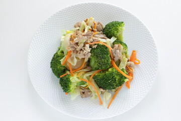 Chinese food,  pork and broccoli stir fried with carrot