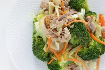 Chinese food,  pork and broccoli stir fried with carrot