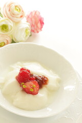 Strawberry Jam and nut on Yogurt for healthy breakfast