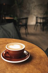 Side view cup of coffee latte on wood backround, hot coffee.