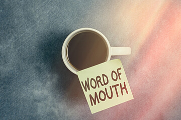 Conceptual hand writing showing Word Of Mouth. Concept meaning information that is transmitted...