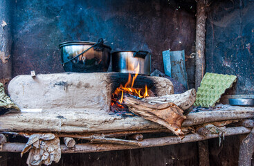 Rustic old simple wood stove of a colombian farmer front photo