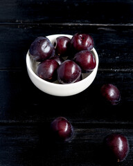 prunes on black background
