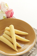 baby corn on dish with copy space