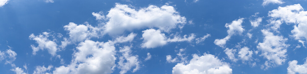Naklejka na ściany i meble Panoramic view of vivid blue sky and white cumulus clouds, creative copy space, horizontal aspect
