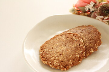 Fototapeta na wymiar Japanese confectionery, almond nut cracker on dish