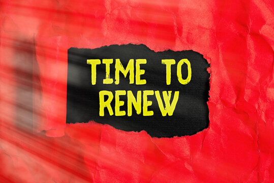Text sign showing Time To Renew. Business photo text extending the period when something is valid and restorable Rolled ripped torn cardboard placed above a wooden classic table backdrop