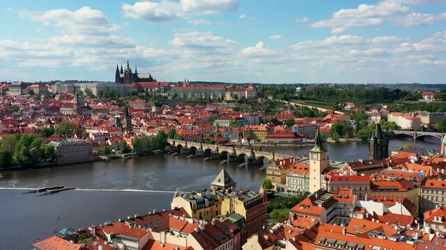 Panoramic view from above on the Prague center, aerial of the Prague city, view from above on the cityscape of Prague, flight over the city, top view, Vltava River, Charles Bridge, Prague, Czechia.