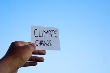 Hand holding Climate change text concept. Ready Text for environment earth day concept