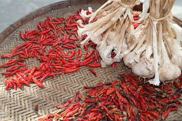 Chilies in a basket with garlic